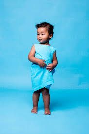 A child in blue with the blue background